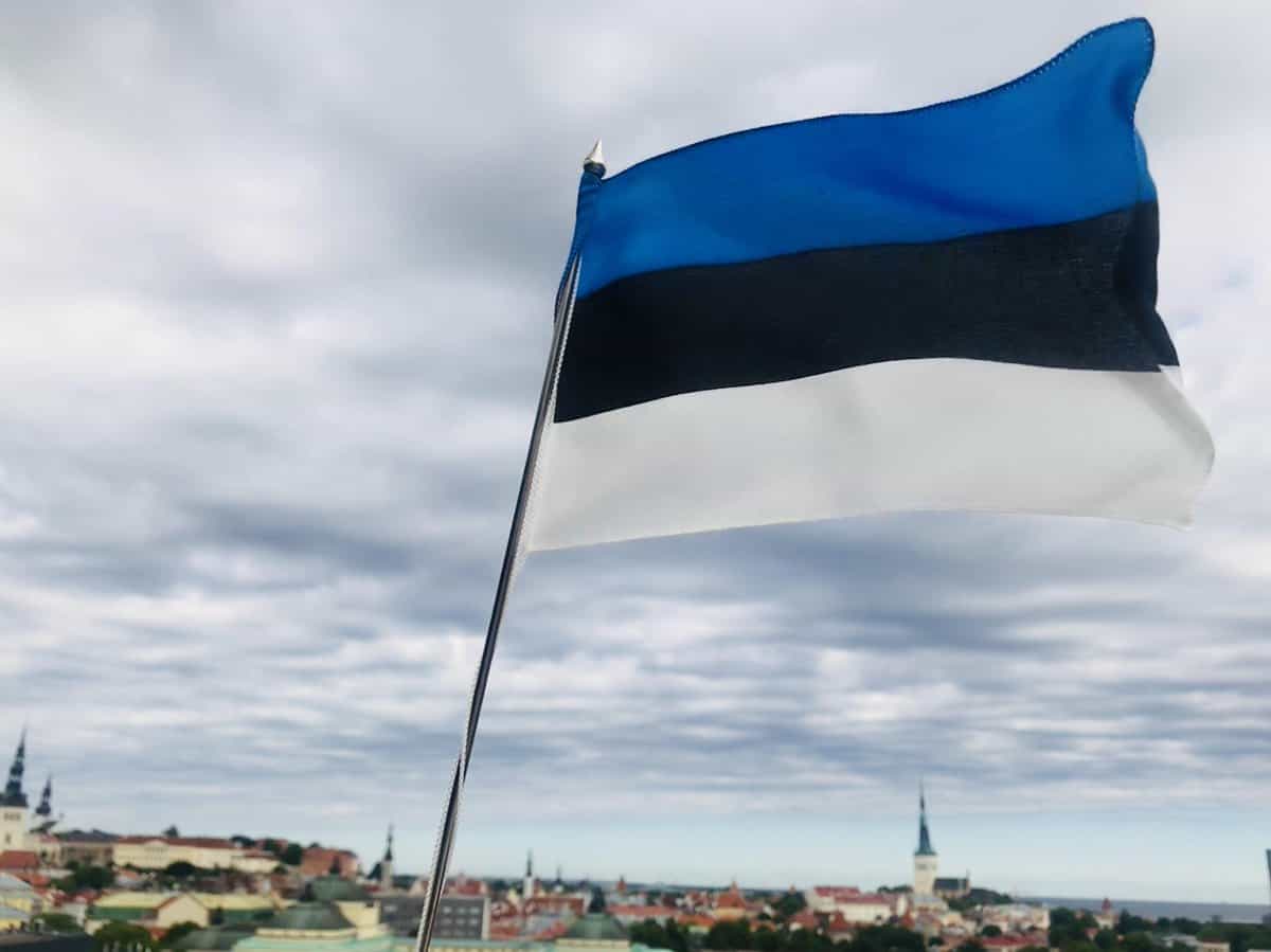 Estonian flag on the backdrop of Old Town Tallinn